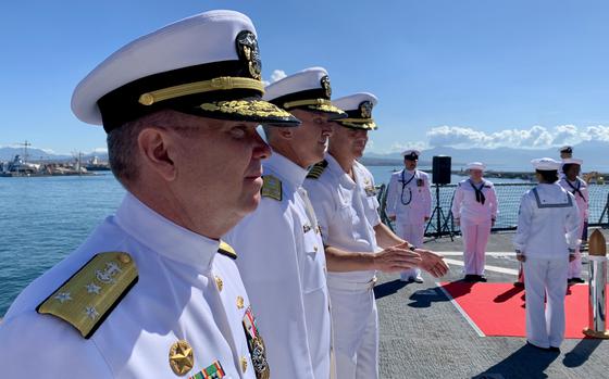 Vice Adm. Thomas Ishee, former commander of U.S. 6th Fleet, left, stands next to Vice Adm. Jeffrey Anderson, commander of 6th Fleet, center, following a change of command ceremony aboard the amphibious command ship USS Mount Whitney in Naples, Italy, on Sept. 20, 2024. 