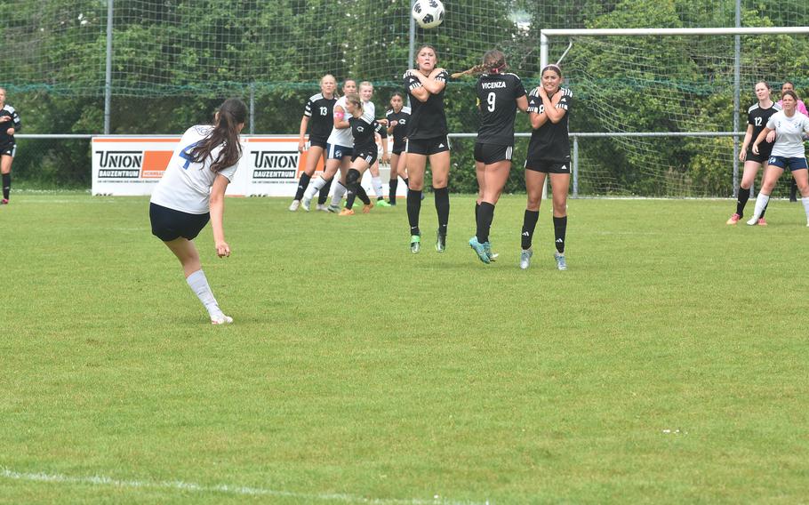 Black Forest Academy's Hana Radi launches a free kick towards a wall of Vicenza defenders Wednesday, May 22, 2024, at the DODEA European Division II girls soccer championships at Reichenbach-Steegen, Germany.