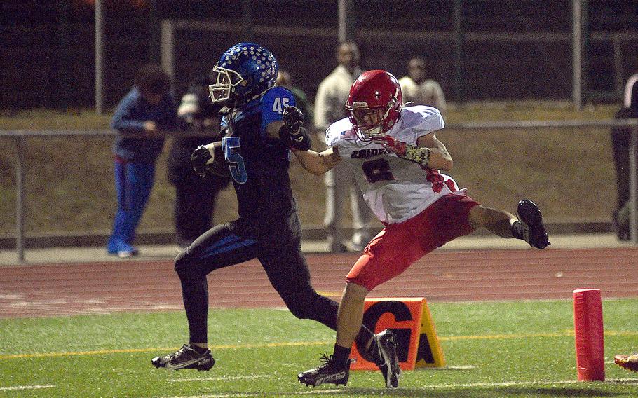 Ramstein running back Kydan Echard shrugs off Kaiserslautern defender Braden Carson during a Sept. 13, 2024, game at Ramstein High School on Ramstein Air Base, Germany.