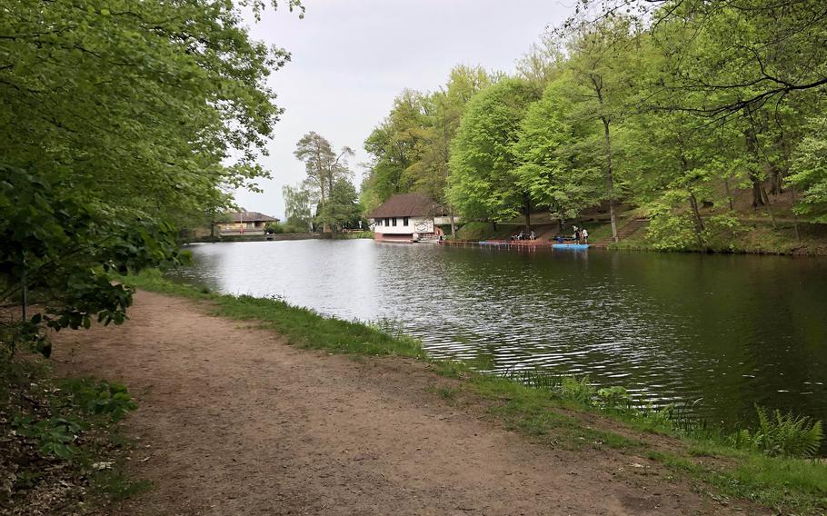 Woodsy hiking and biking trails run along the Bärenloch in Kindsbach, Germany. In the background is the Kahnhaus restaurant. 