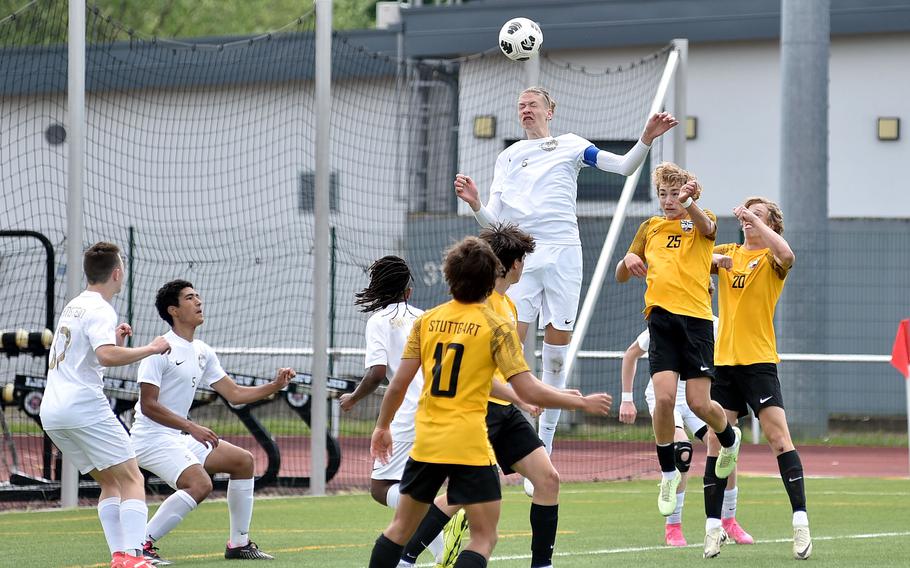 Ramstein junior Kelan Vaughn leaps up for a corner over Stuttgart's Maddox Boudreaux, second from right, and Jacob Schudel in a Division I semifinal of the DODEA European soccer championships May 22, 2024, at Kaiserslautern High School in Kaiserslautern, Germany. 