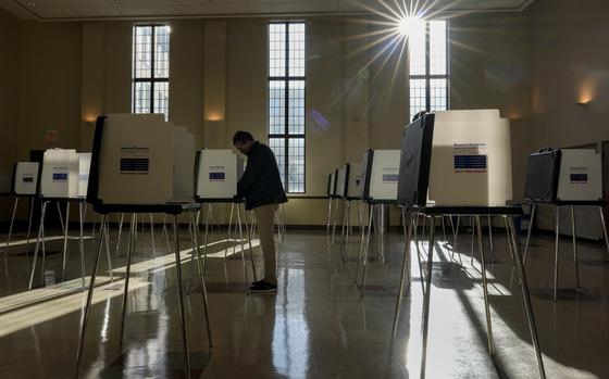 FILE - A voter fills out their Ohio primary election ballot at a polling location in Knox Presbyterian Church in Cincinnati, Ohio, on Tuesday, March 19, 2024. (AP Photo/Carolyn Kaster, File)