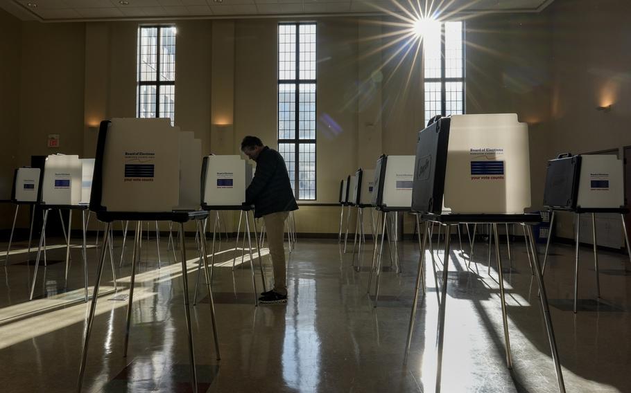 A voter fills out their Ohio primary election ballot at a polling location in Knox Presbyterian Church in Cincinnati.