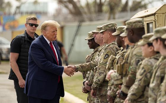 FILE - Republican presidential candidate former President Donald Trump greets members of the National Guard on the U.S.-Mexico border, Feb. 29, 2024, in Eagle Pass, Texas. Recent statements by Trump have fueled Democrats' sense that there's an opening among voters with strong military ties, and progressive veterans' organizations are working to bridge the gap with what has long been a reliably red constituency. (AP Photo/Eric Gay, File)