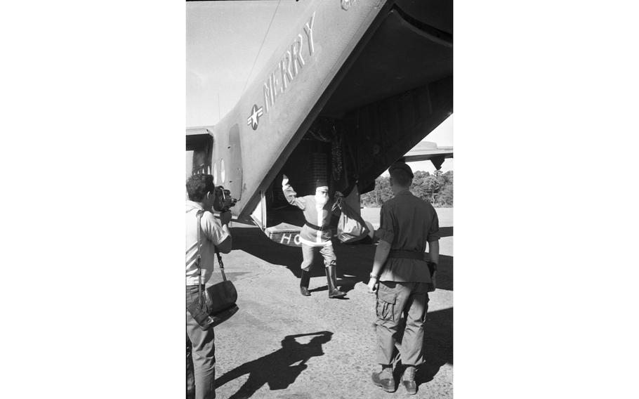 Santa Claus steps off his “sled” at Nhon Cho, home of Detachment 35, “B” Company, 5th Special Forces Group, 80 miles northeast of Saigon.