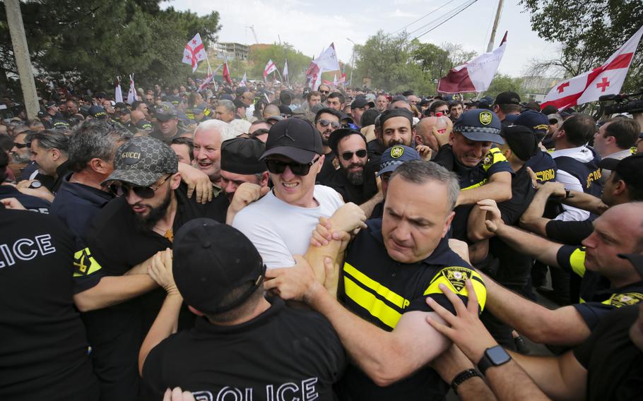 Police restrain Georgian opponents of pride party