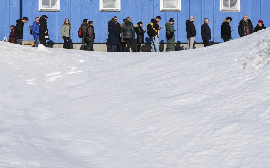 People waiting to vote outside a voting center.