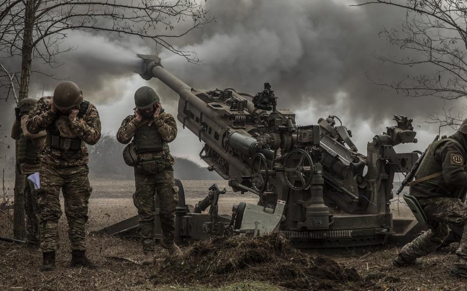 A Ukrainian artillery unit fires an M777 howitzer at Russian armored vehicles near the town of Snihurivka in Ukraine’s southern Mykolaiv region in November 2022.
