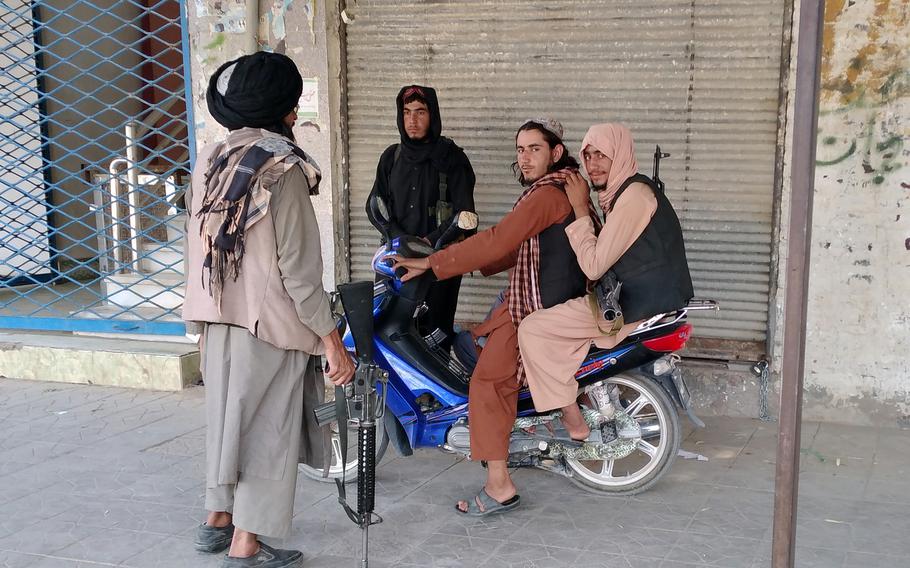 Taliban fighters patrol inside the city of Farah, capital of Farah province southwest of Kabul, Afghanistan, Wednesday, Aug. 11, 2021.