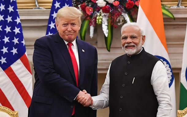 India's Prime Minister Narendra Modi, right, shakes hands with President Donald Trump before a meeting at Hyderabad House in New Delhi on Feb. 25, 2020. (Mandel Ngan/AFP/Getty Images/TNS)