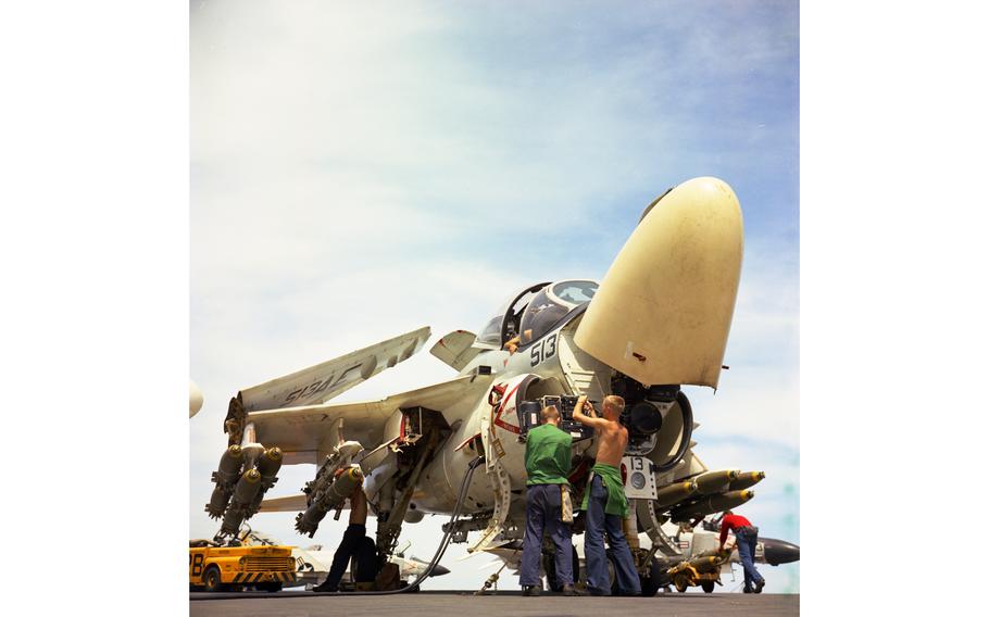 500-pound bombs are loaded onto a A-6A Intruder by the flight-deck crew of the USS America, north of Dong Hoi, Gulf of Tonkin, July 15, 1968. 