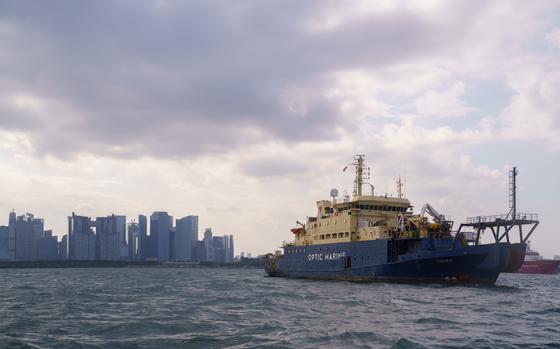 View of a subsea cable repair ship off the coast of Singapore, which has become a hub for cables in Asia.