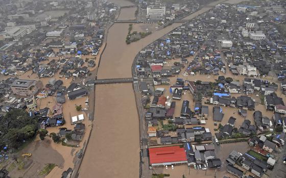 This aerial photo shows the flooded Kawarada river and submerged area after heavy rain in Wajima, Ishikawa prefecture, Saturday, Sept. 21, 2024. (Kyodo News via AP)