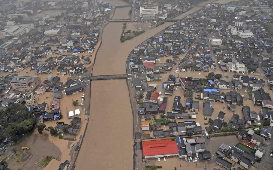 This aerial photo shows the flooded Kawarada river and submerged area after heavy rain in Wajima, Ishikawa prefecture, Saturday, Sept. 21, 2024.