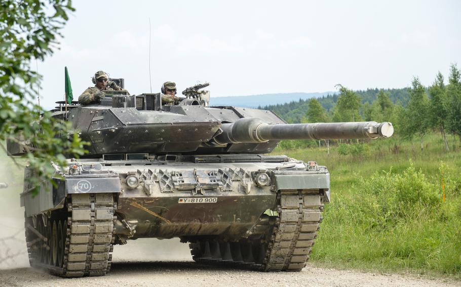 A German tank drives on a path.