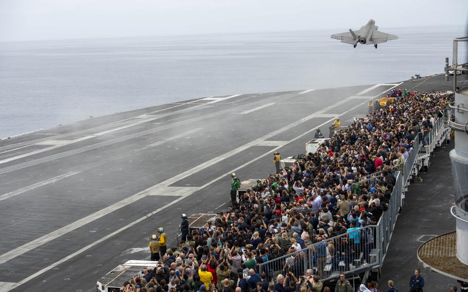 Sailors and their guests watch as an F-35C Lighting II, assigned to the “War Hawks” of Strike Fighter Squadron (VFA) 97, takes off from the flight deck aboard Nimitz-class aircraft carrier USS Carl Vinson (CVN 70) during an airpower demonstration while underway for a Family and Friends Day Cruise on Saturday, Aug. 17, 2024.