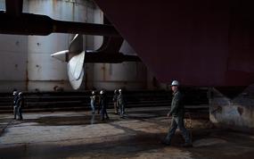 240403-N-TU663-1055 NEWPORT NEWS, Va. (April 3, 2024) - Capt. J. Patrick Thompson, right, commanding officer of the Nimitz-class aircraft carrier USS John C. Stennis (CVN 74), conducts a dry dock walkthrough in preparation of flooding the dry dock in Newport News, Virginia, April 3, 2024. John C. Stennis is in Newport News Shipbuilding conducting Refueling and Complex Overhaul to prepare the ship for the second half of its 50-year service life. (U.S. Navy photo by Mass Communication Specialist 3rd Class Daniel Perez)