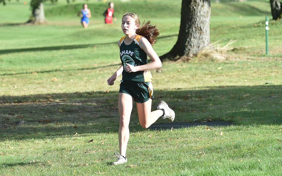 SHAPE's Rhianna Bender runs during an Oct. 14, 2023, meet at Rolling Hills Golf Course in Baumholder, Germany.