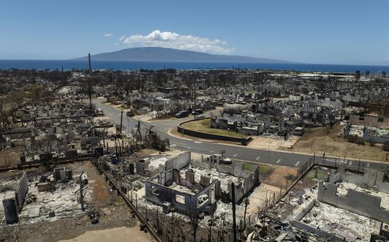 FILE - Destroyed homes are visible in the aftermath of a devastating wildfire in Lahaina, Hawaii, Aug. 22, 2023. 