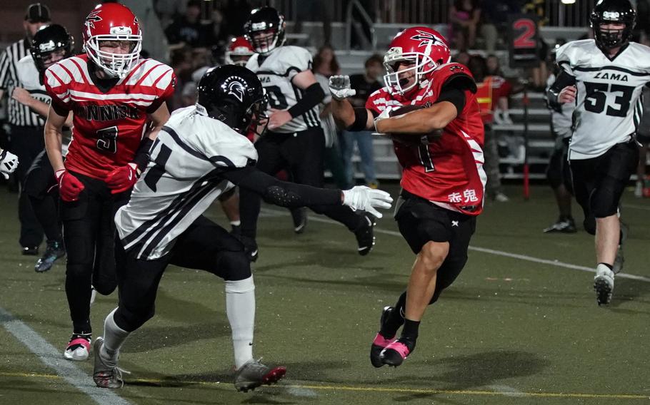 Nile C. Kinnick's Derek Ulrich looks for running room against Zama's Chris Jones.