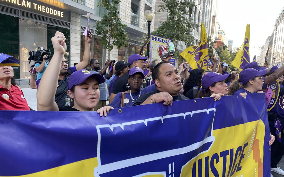 Unionized building workers, including many immigrant office cleaners, march through downtown D.C. on Oct. 2 to draw attention to labor talks and their demand for higher wages.  