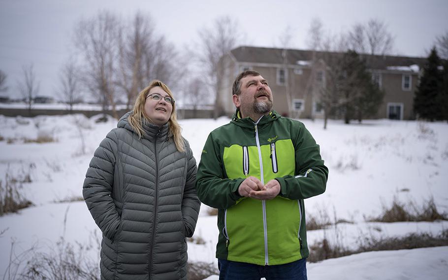 Katya and Artem watched two bald eagles chase each other overhead while on an after dinner walk in their Shakopee neighborhood on March 15, 2023. Artem and Katya and their three kids left Russia last year after it became clear his opposition to the war was going to impact his family. 