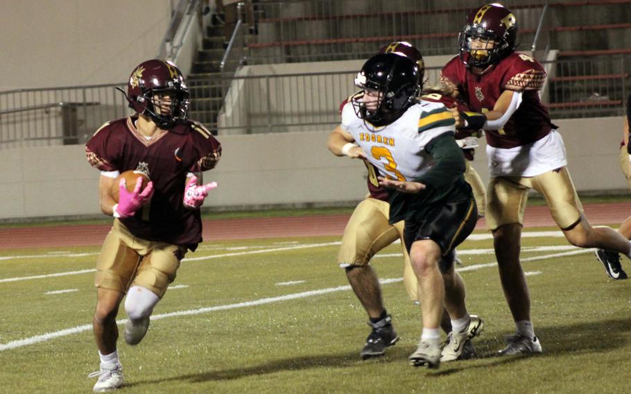 Perry running back Kameron Ramos tries to outrun Edgren defensive end Cole Donnelly.