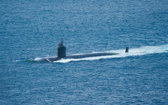 The Los Angeles-class fast-attack submarine USS Asheville transits Apra Harbor near Naval Base Guam, May 21, 2024.
