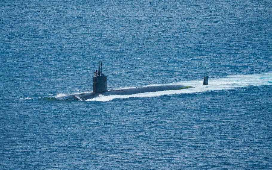 The Los Angeles-class fast-attack submarine USS Asheville transits Apra Harbor near Naval Base Guam, May 21, 2024.