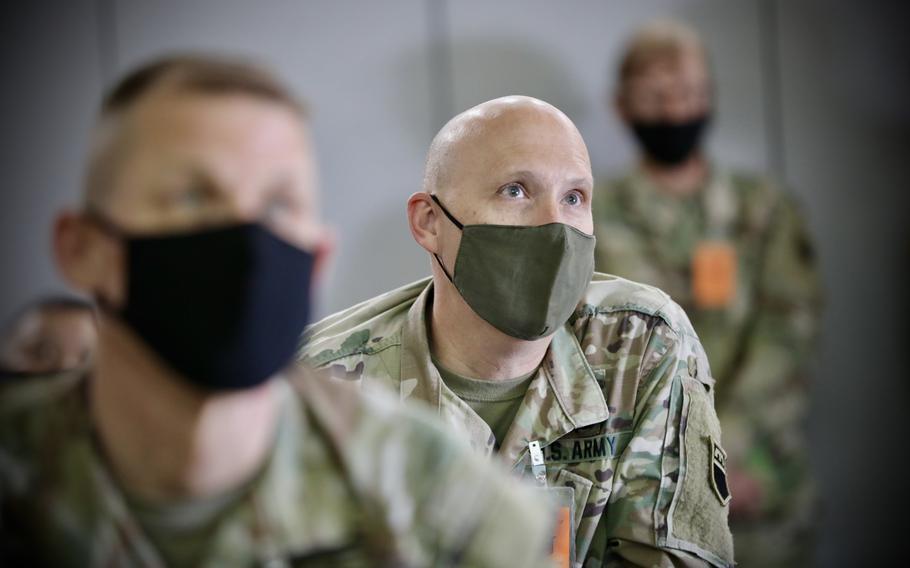 Army Reserve Col. Reece Roberts listens to a briefing on May 2021 at Camp Williams, Utah. 