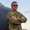 Michael McCullough stands in front of an aircraft at Sheppard Air Force Base.