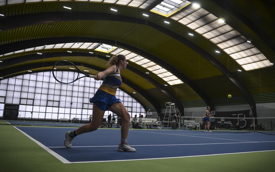 Wiesbaden's Bella Rainey confidently swings to connect with the ball as she and teammate Samaire Fleming challenge Vicenza's dynamic duo, Addie Wilson and Annika Svenson, during the DODEA European tennis championships at T2 Sports Health Club in Wiesbaden, Germany, on Oct. 21, 2023.