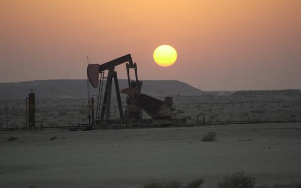 Hed: Sunset and a nodding donkey, 2001

Somewhere in Bahrain, Sept. 29, 2001: An oil well cranks away at sunset in Bahrain.
The pumpjack, a type of small oil pump that's a common sight in West Texas, goes by many nicknames, "nodding donkey" being one of them. 
