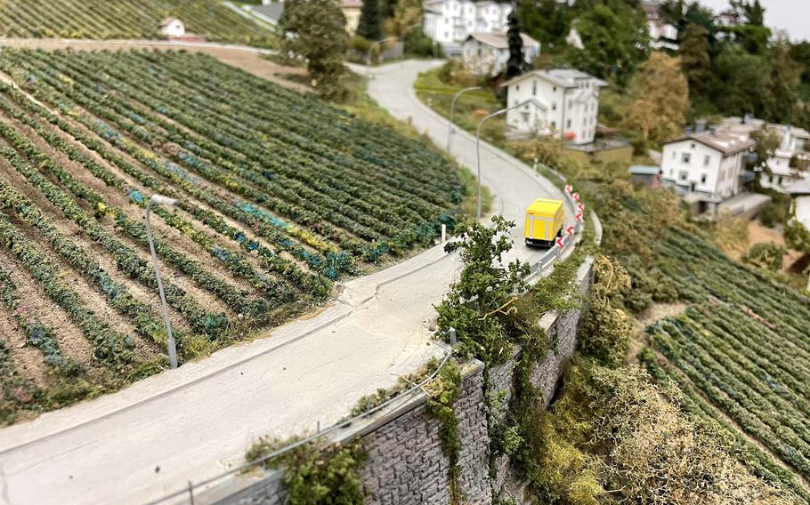 A road runs through the countryside in a model at MiniaturWelten museum in Stuttgart.