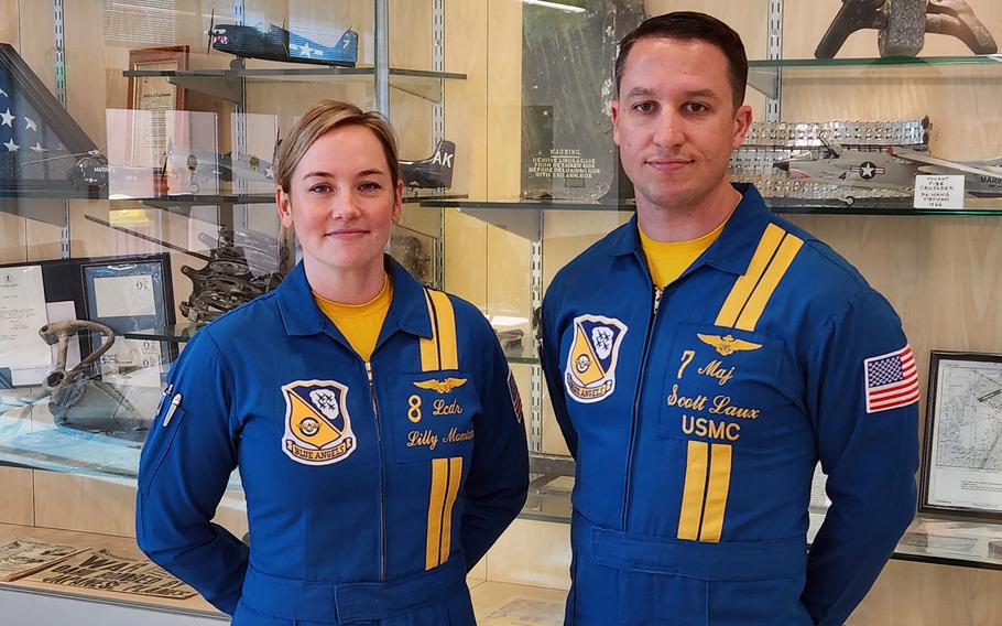 Navy Lt. Cmdr. Lilly Montana and Marine Corps Maj. Scott Laux, aviators with the Blue Angels demonstration flight team, pose at Marine Corps Air Station Kaneohe Bay, Jan. 10, 2025.