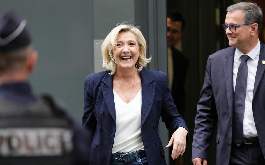 Marine Le Pen, the former president of the French parliamentary group Rassemblement National (RN) and Louis Aliot, RN mayor of Perpignan, leave the party’s headquarters in Paris on July 2, 2024. 