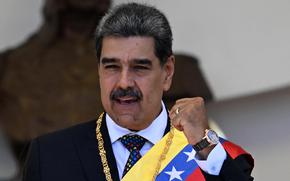 Venezuela's President Nicolas Maduro gestures as he leaves the Capitolio — home of the National Assembly — after taking the oath during the presidential inauguration in Caracas on Jan.10, 2025. (Juan Barreto/AFP/Getty Images/TNS)