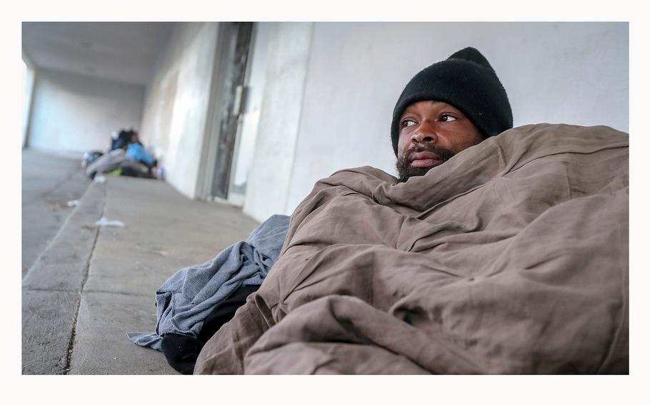 In January, Antwan Slaton bundled up while sleeping on a sidewalk in Atlanta. Slaton spent the night on South Rhodes Center in Midtown at a time when morning temperatures were in the upper teens and lower 20s across the metro Atlanta area.