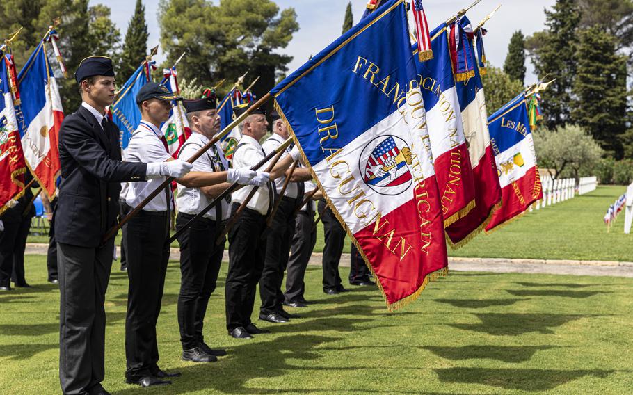 A French color guard salutes at the end of a ceremony, Aug. 16, 2024, at the Rhone American Cemetery in Draguignan, France.