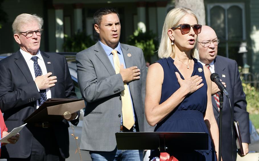 U.S. Rep. Mary Miller leads the recitation of the Pledge of Allegiance during a ceremony on July 6, 2024, as a section of State Highway 133 through Oakland, Ill., was named the 1st Lt. Jared W. Southworth Highway. 