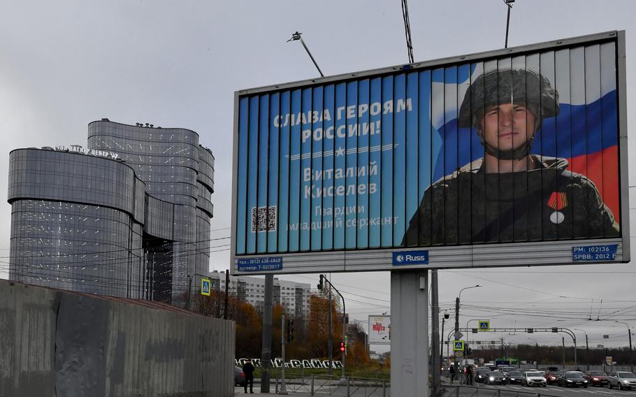 A poster seen on Nov. 4, 2022, shows a Russian soldier with a slogan reading “Glory to the Heroes of Russia” decorating a street near the PMC Wagner Center, associated with the founder of the Wagner private military group Yevgeny Prigozhin, during the official opening of the office block on National Unity Day in Saint Petersburg.