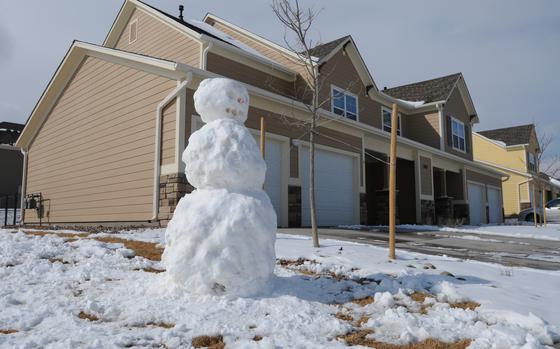 A snowman keeps watch over the neighborhood in Iroquois Village on Fort Carson, Feb. 22, 2013. Iroquois Village, like many other on-post housing, is a neighborhood watch zone to increase the security of living on-post. (U.S. Army photo by Sgt. Eric Glassey, 4th Inf. Div. PAO)