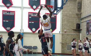 Joel Idowu is on his way down after slamming the ball through the net in Wiesbaden's victory over Lakenheath on Satuday, Jan. 25, 2025, at RAF Lakenheath, England. Idowu scored a game-high 19 points.

Loretto Morris/Stars and Stripes