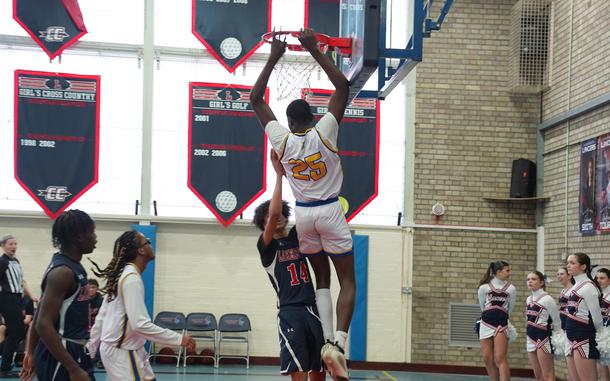 Joel Idowu is on his way down after slamming the ball through the net in Wiesbaden's victory over Lakenheath on Satuday, Jan. 25, 2025, at RAF Lakenheath, England. Idowu scored a game-high 19 points.

Loretto Morris/Stars and Stripes