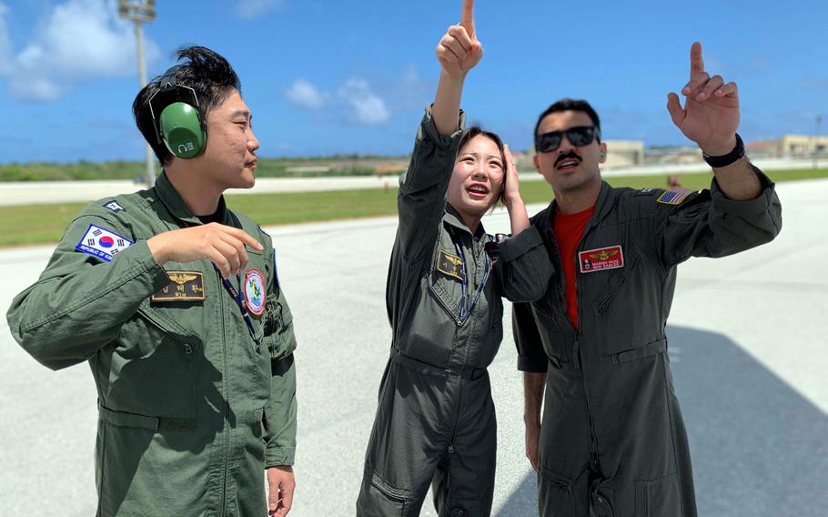 Sailors demonstrate preflight safety checks on a P-8A Poseidon. 