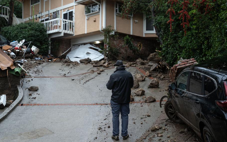 Rocks and debris litter streets and driveways along Fryman Canyon in Studio City, Calif., after an atmospheric river blasted central and Southern California in February.  