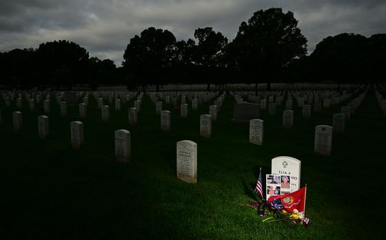 Items left at a grave in Arlington National Cemetery’s Section 60, where those who died in America’s post-9/11 wars are buried. MUST CREDIT: Matt McClain/The Washington Post