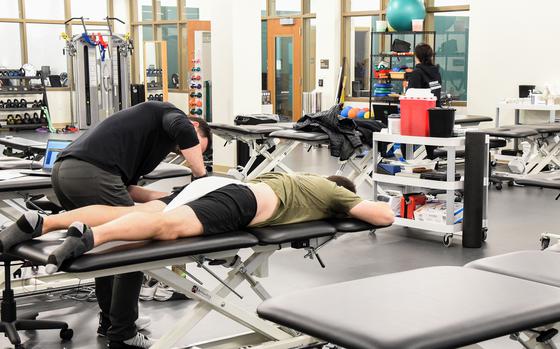 A physical therapist works on a Special Forces soldiers at the new Human Performance Force Generation, or HP Forge, facility for the Army’s John F. Kennedy Special Warfare Center and School at Fort Liberty, N.C., on Jan. 23, 2025. The new facility provides more than a dozen physical therapy beds and advanced equipment designed to speed healing for injured troops in the Special Forces training pipeline. (Corey Dickstein/Stars and Stripes)