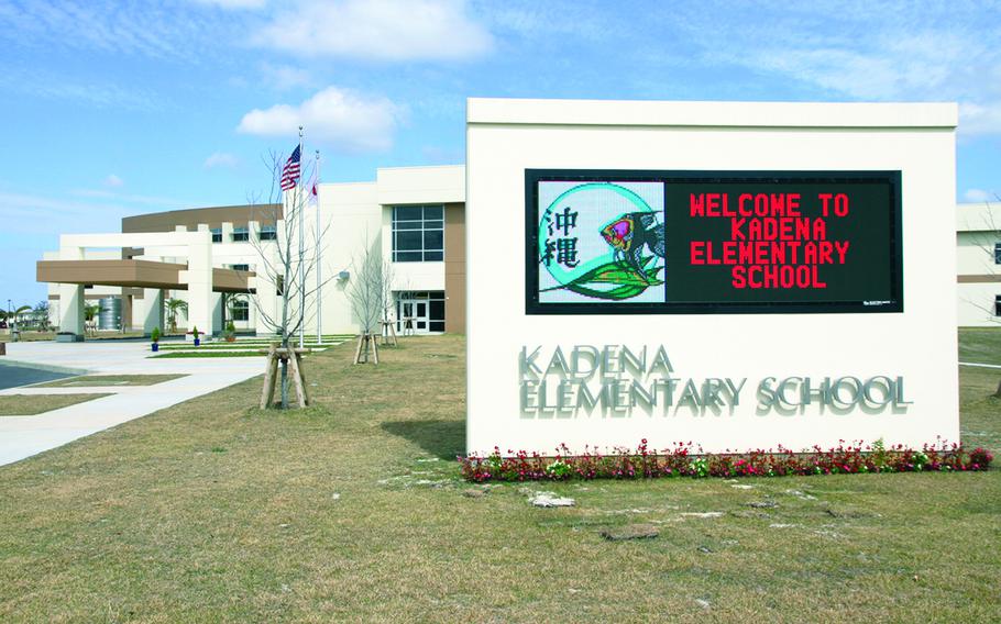 A sign outside a school on Okinawa says, “Welcome to Kadena Elementary School.”