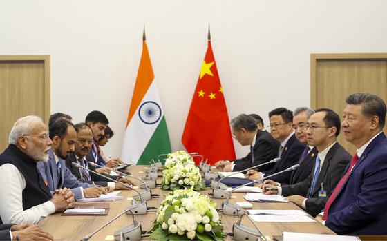 Chinese President Xi Jinping, right, at a meeting with Indian Prime Minister Narendra Modi, left, Oct. 23, 2024.